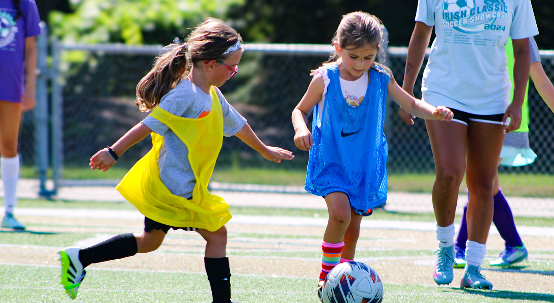 Students playing soccer outdoors