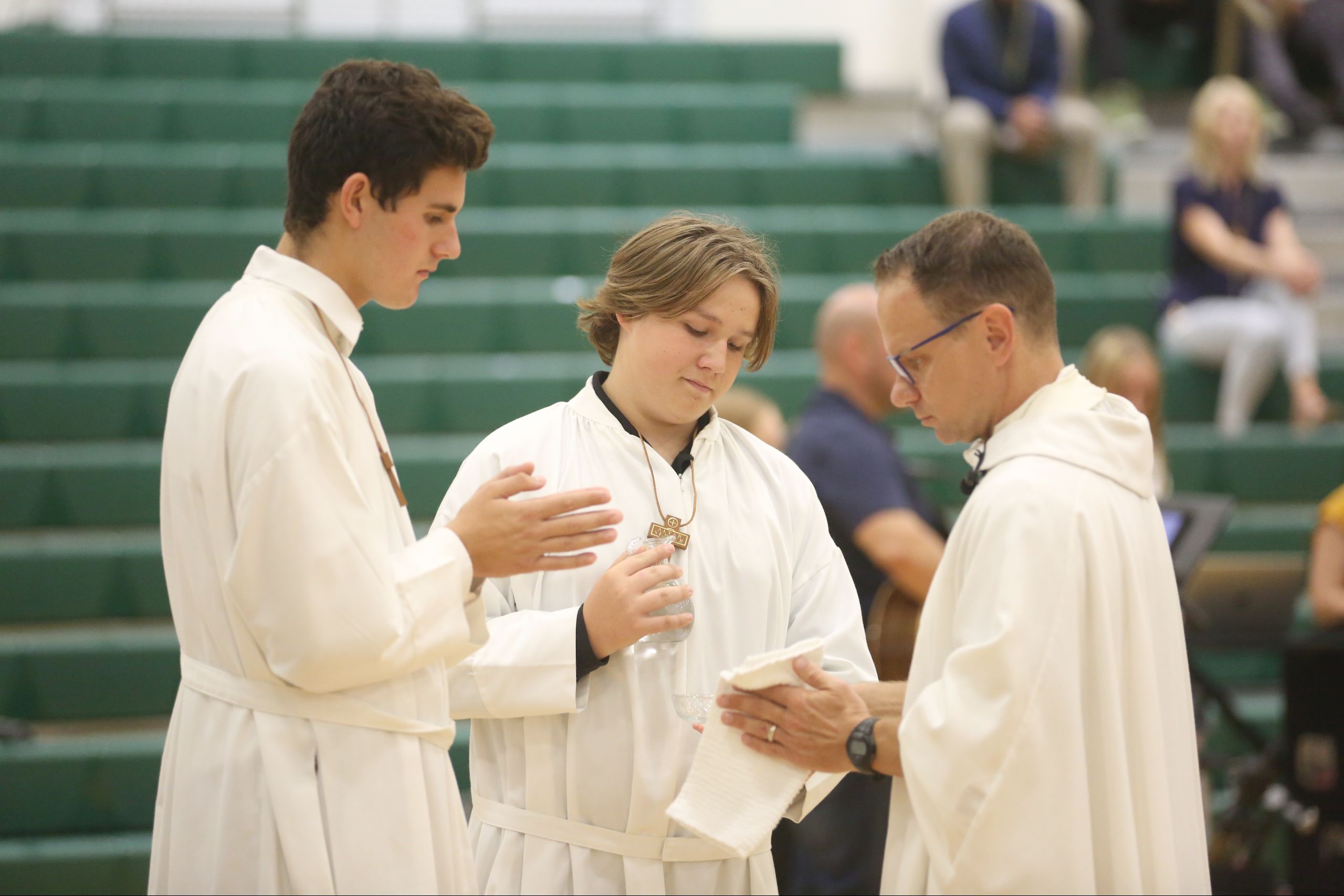 STVM students serving with the Priest at a school Mass.