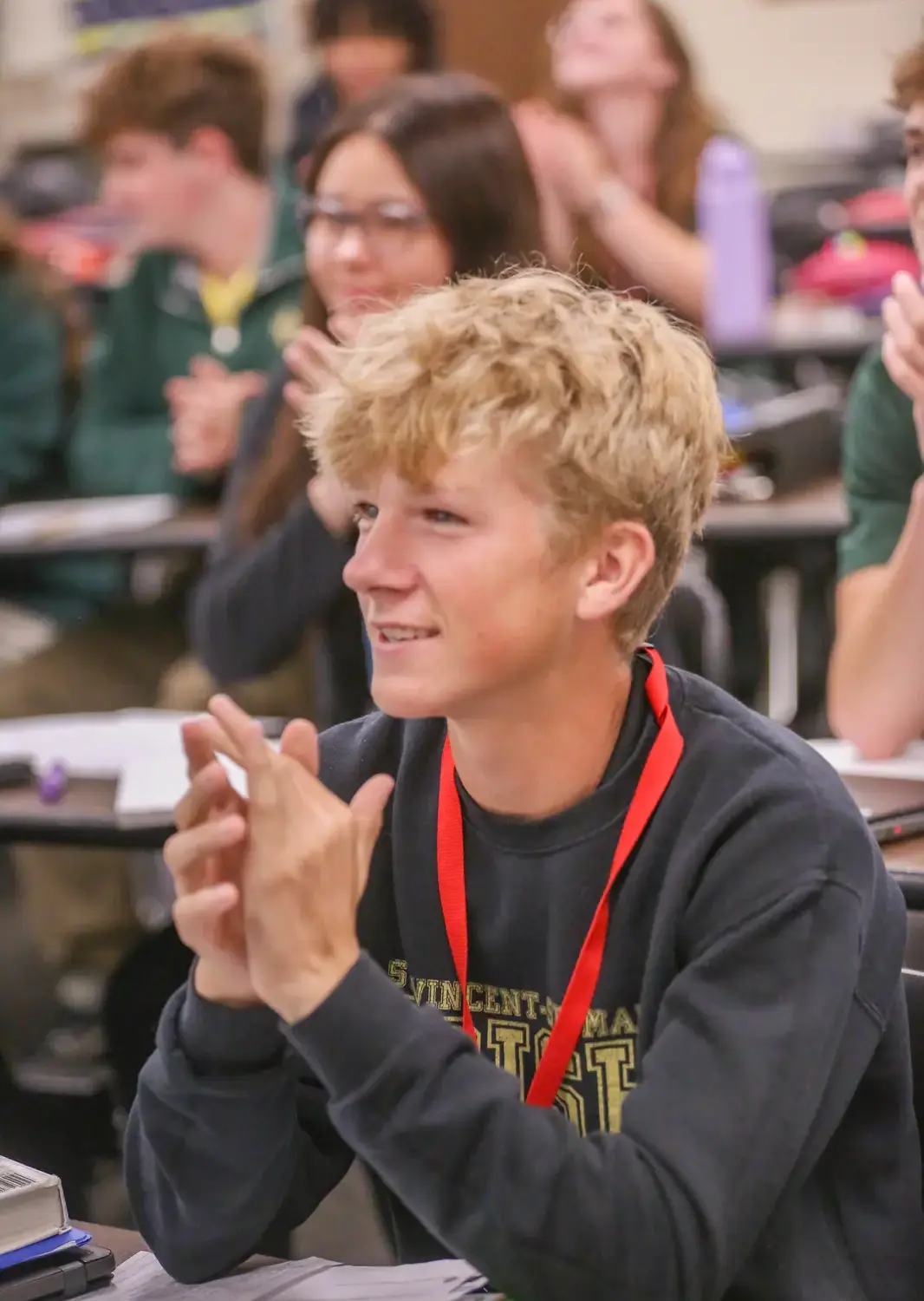 St Vincent St Mary High School student giving a round of applause in class.