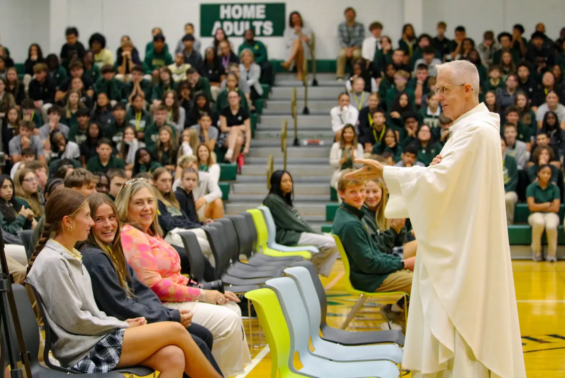 St. Vincent-St. Mary High School students listening to a sermon.