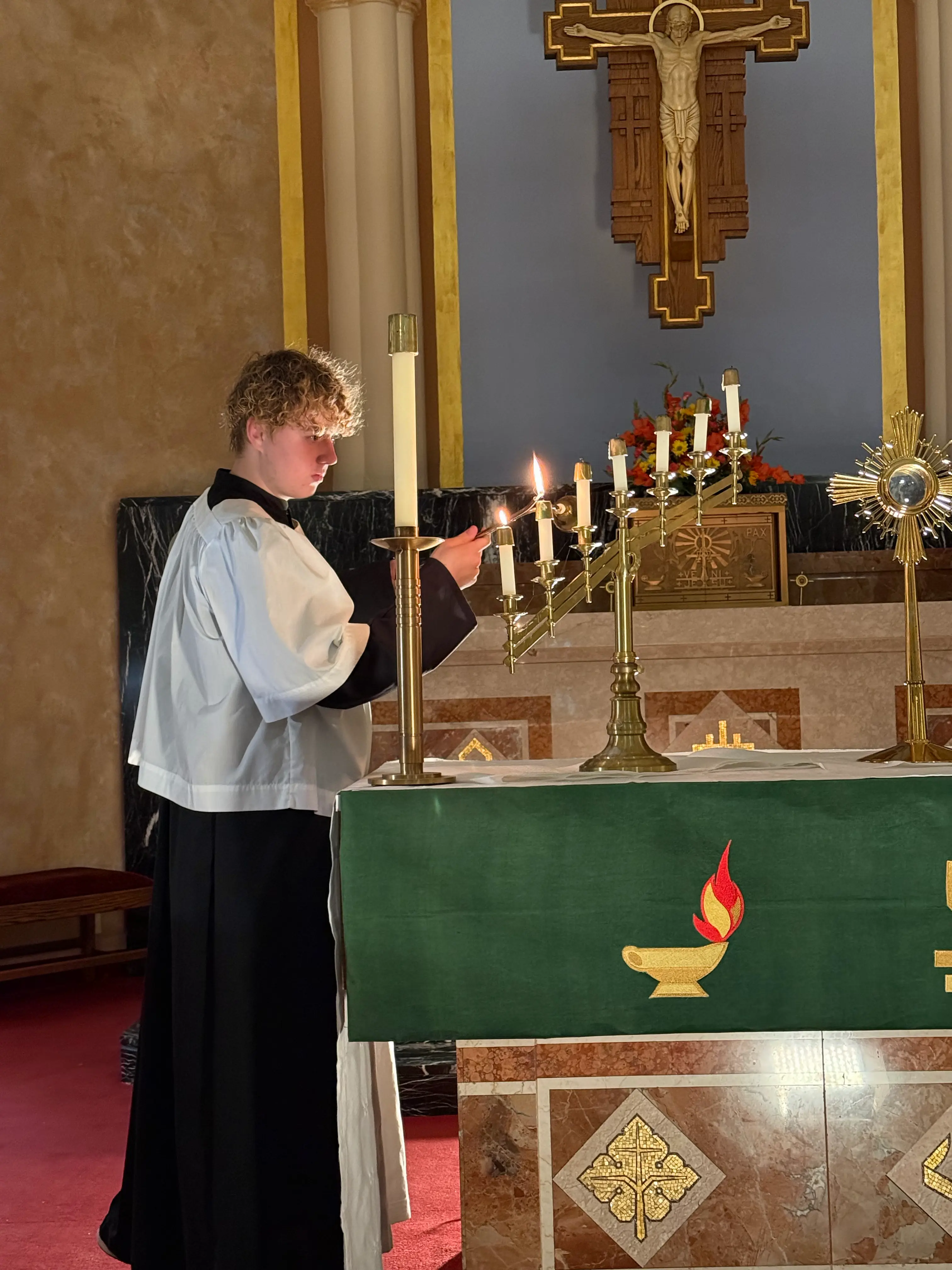 St. Vincent-St. Mary High School students taking part in the Eucharist during a Mass.
