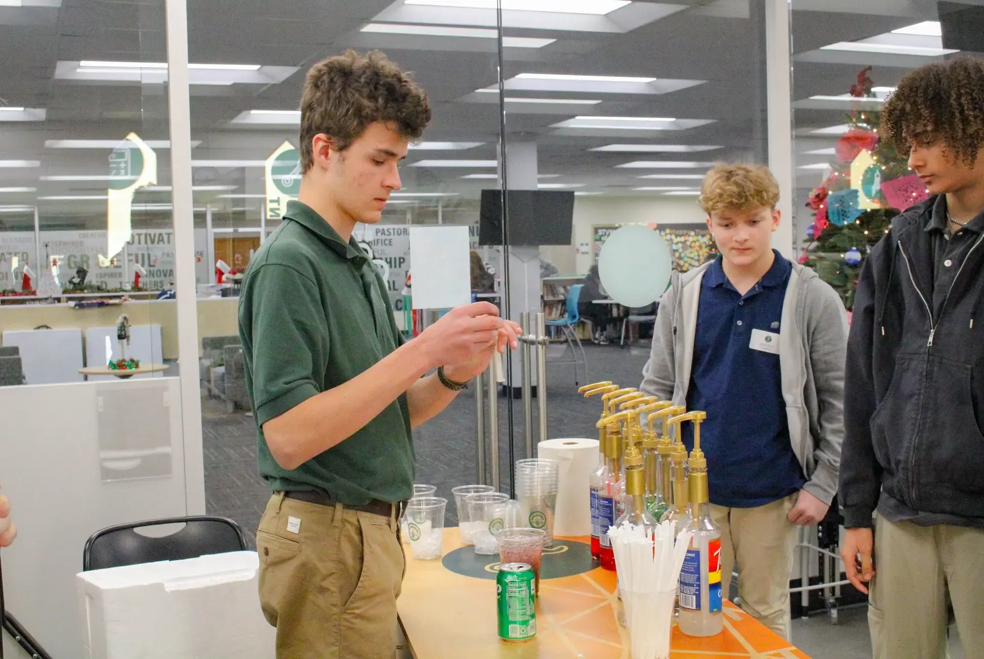 STVM student preparing a drinks table for an event.