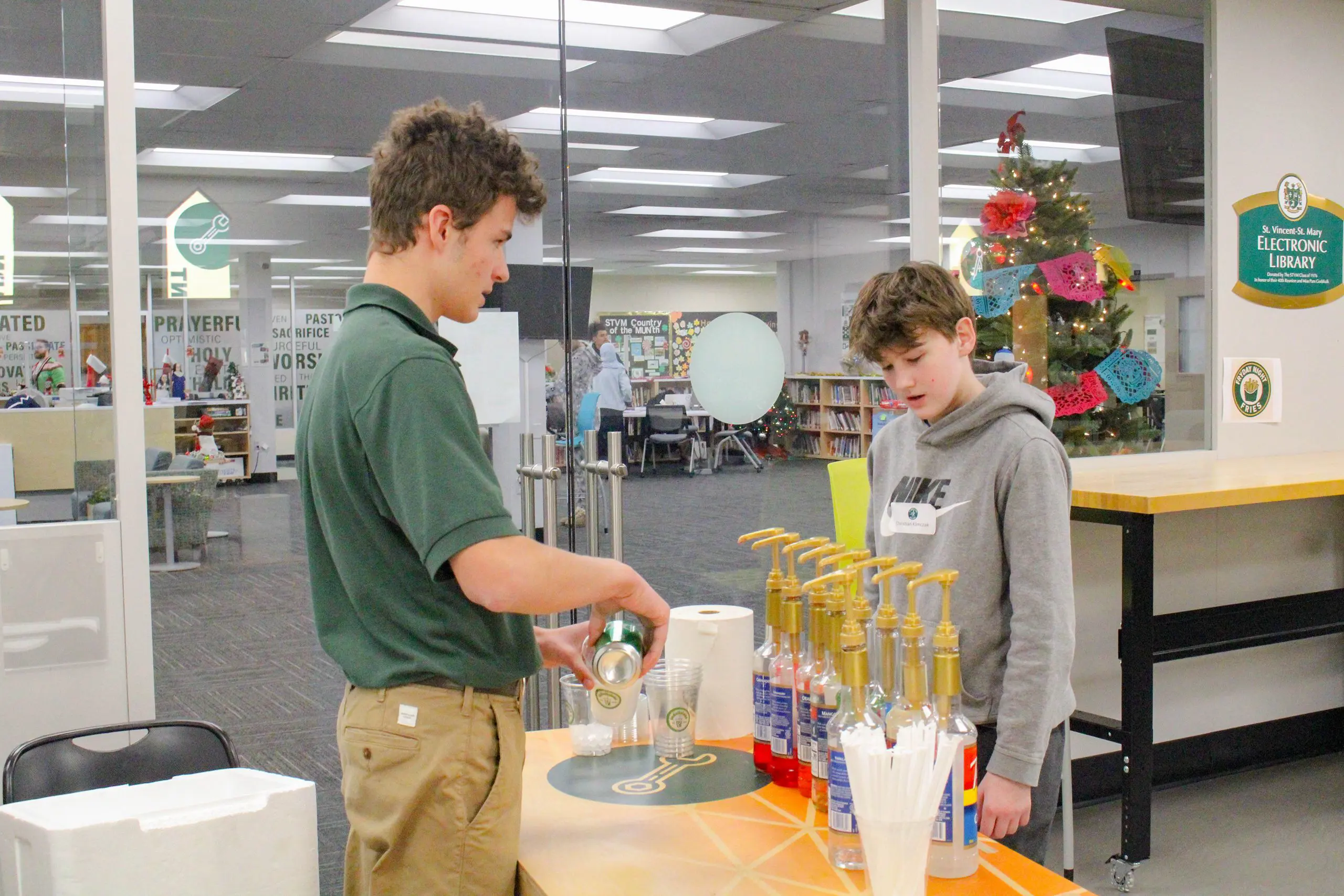 STVM student preparing a drinks table for an event.