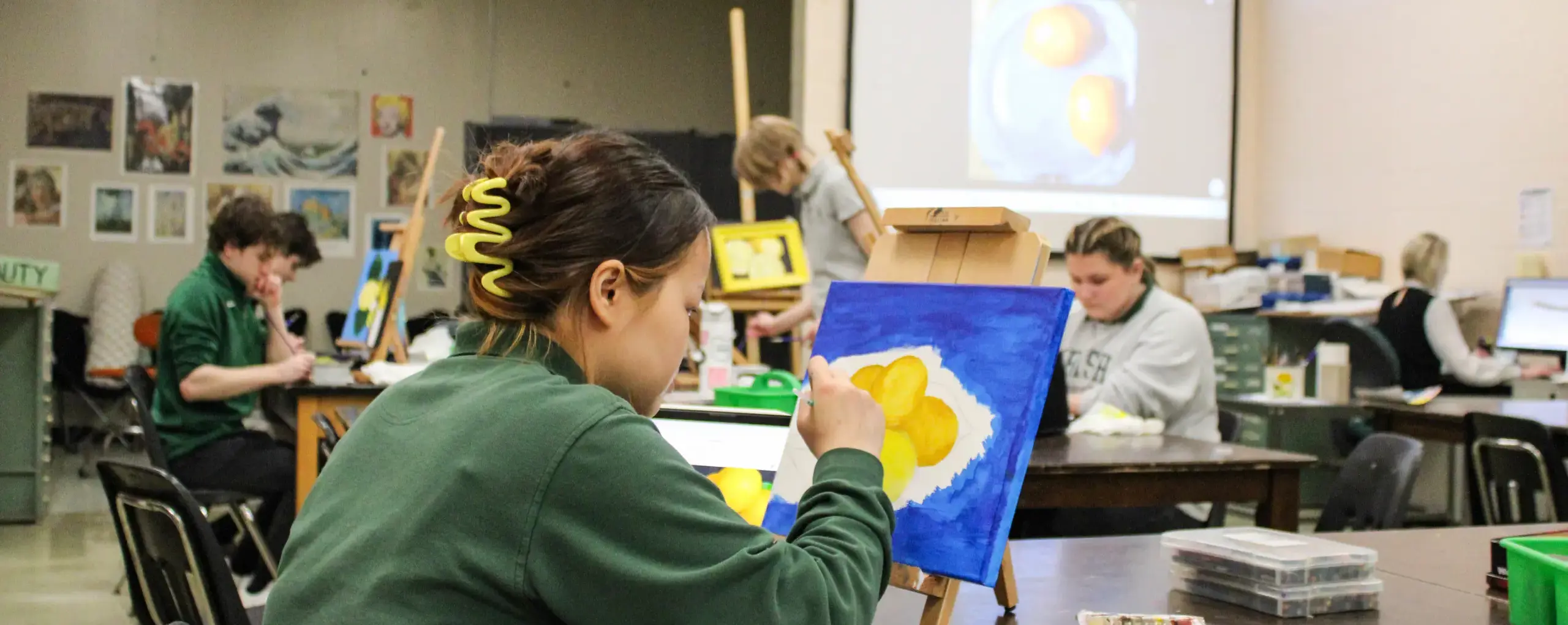 St Vincent St Mary High School student painting lemons in an art class.