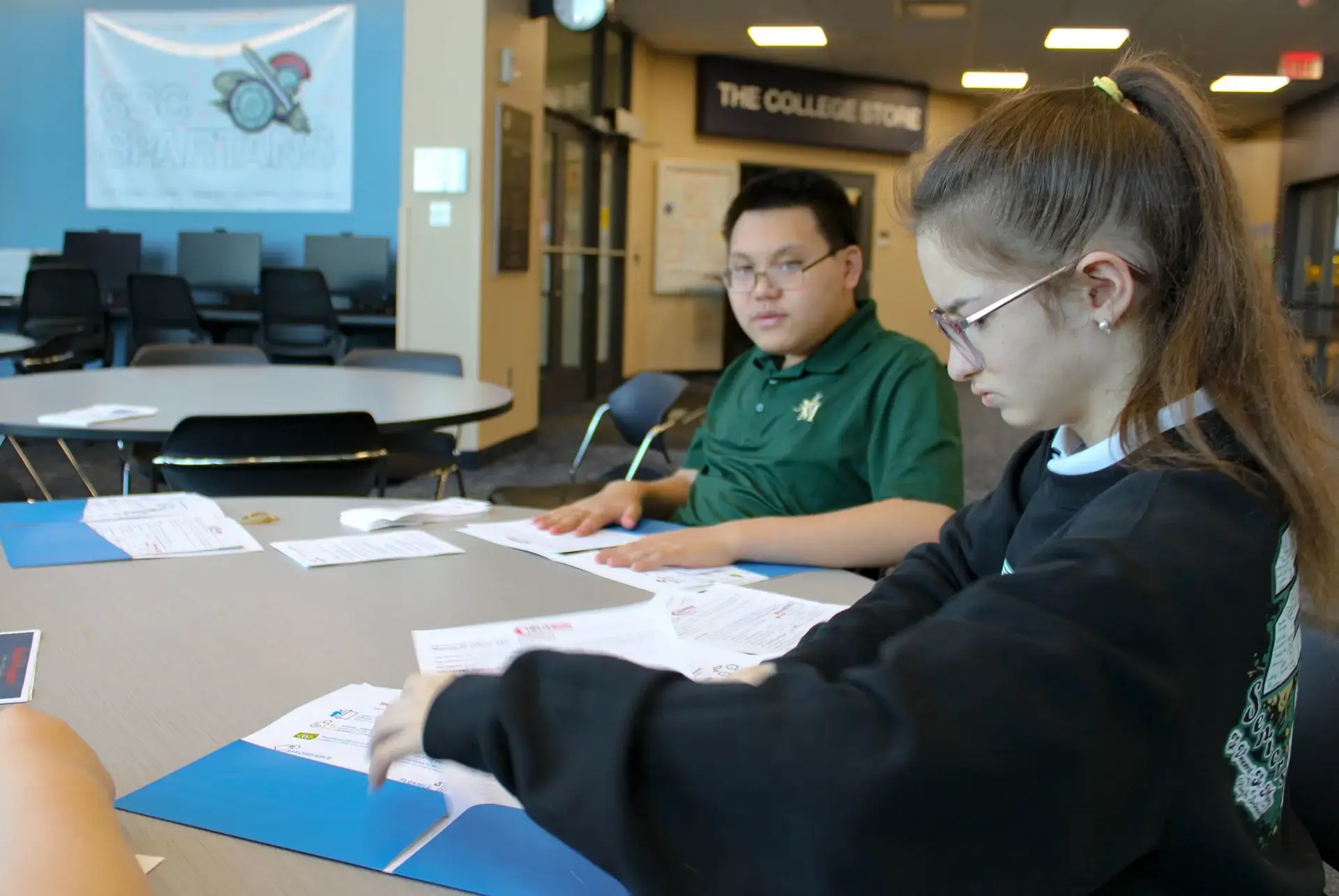 St. Vincent-St. Mary High School students doing worksheets as part of the Transition-to-Work Program.