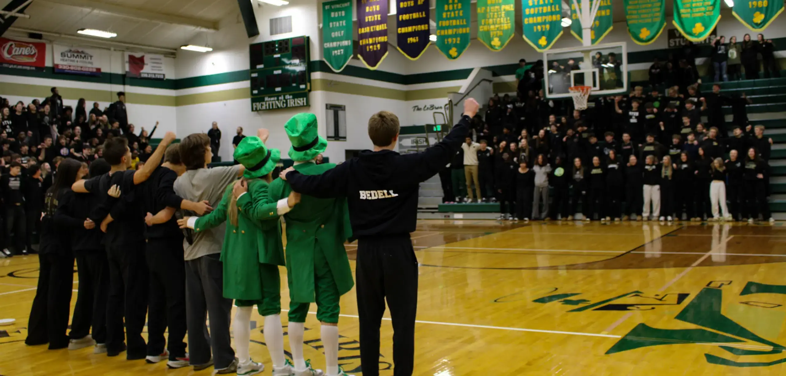 St Vincent St Mary High School students wearing school mascot outfits during assembly.