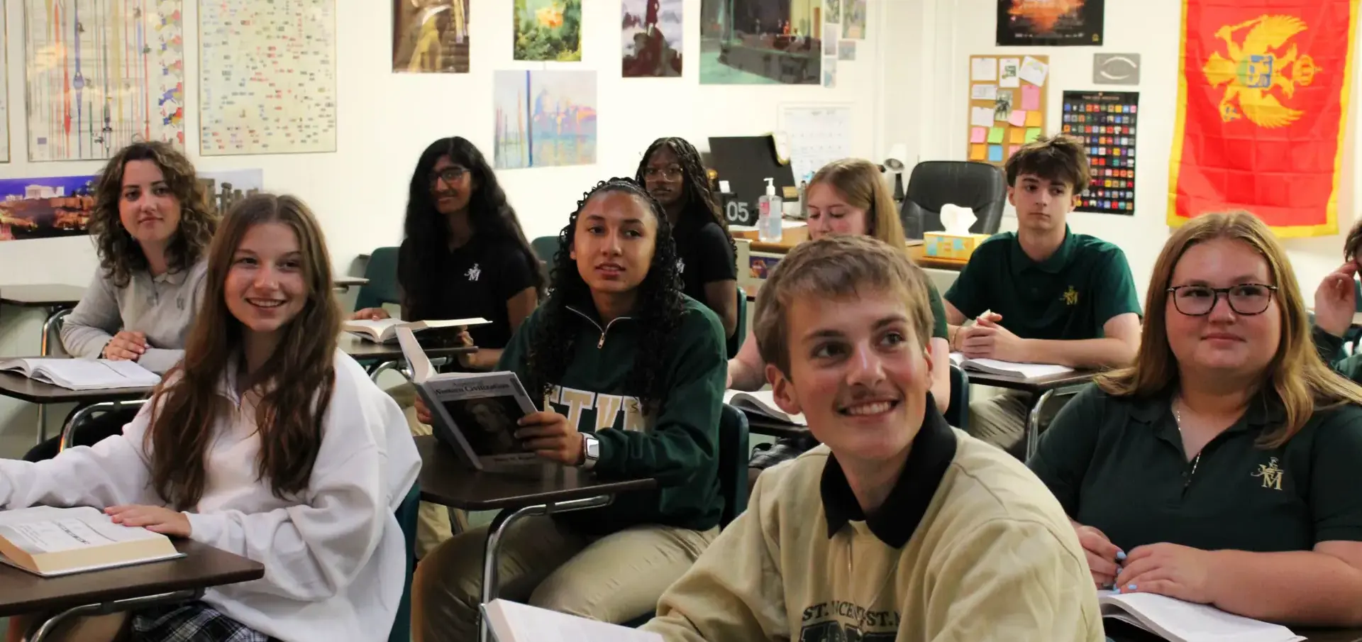 St Vincent St Mary High School students in class, listening attentively, smiling.