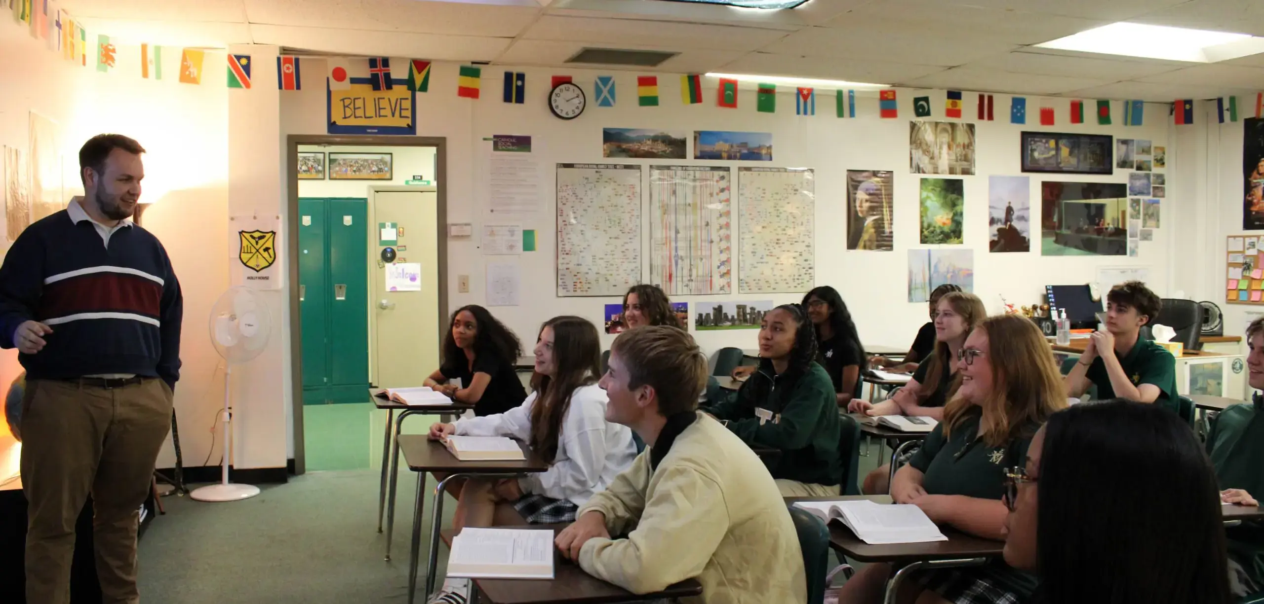 St Vincent St Mary High School students listening to a teacher in a class.