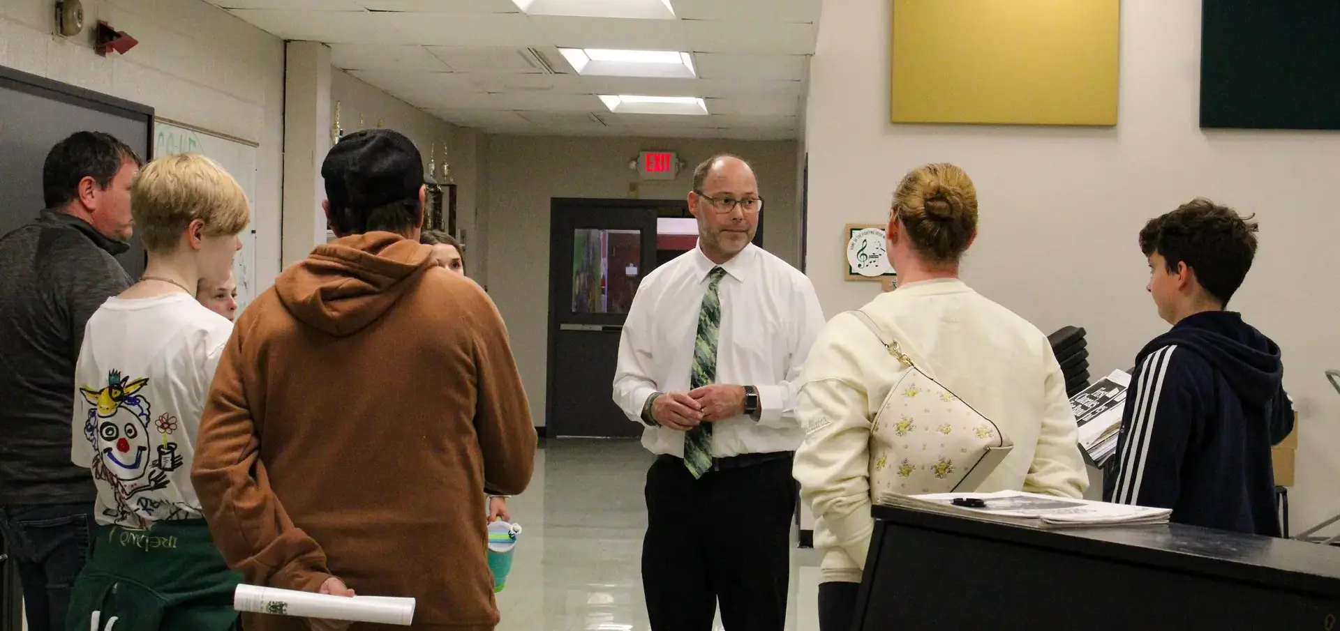 STVM teacher showing prospective students and their parents around the school.
