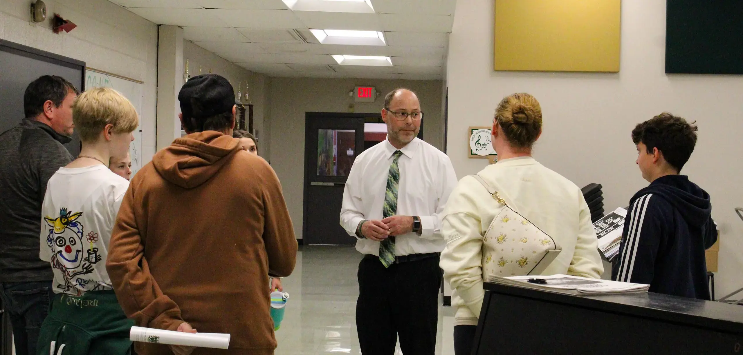 STVM teacher showing prospective students and their parents around the school.