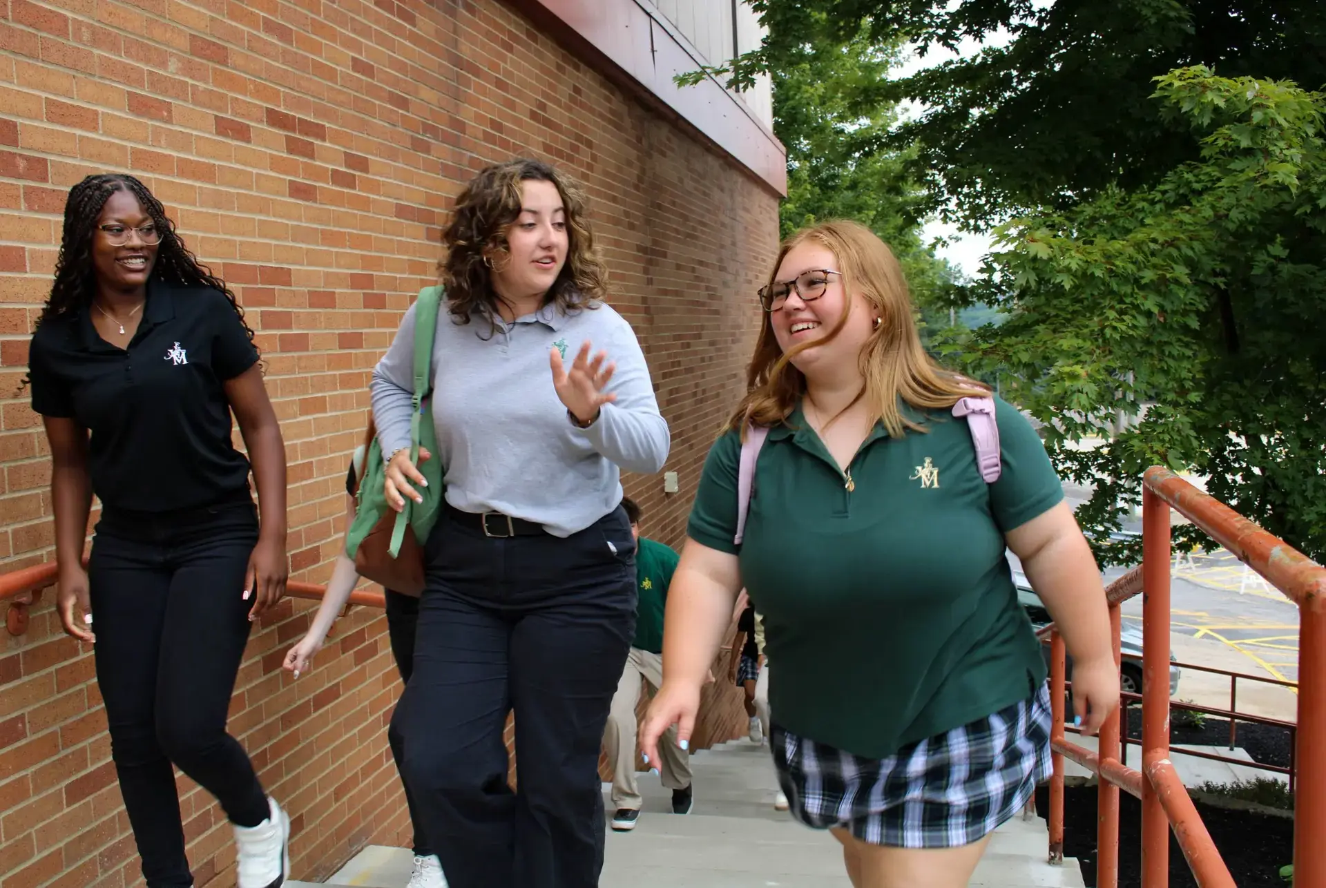 STVM students walking into school, wearing uniform.