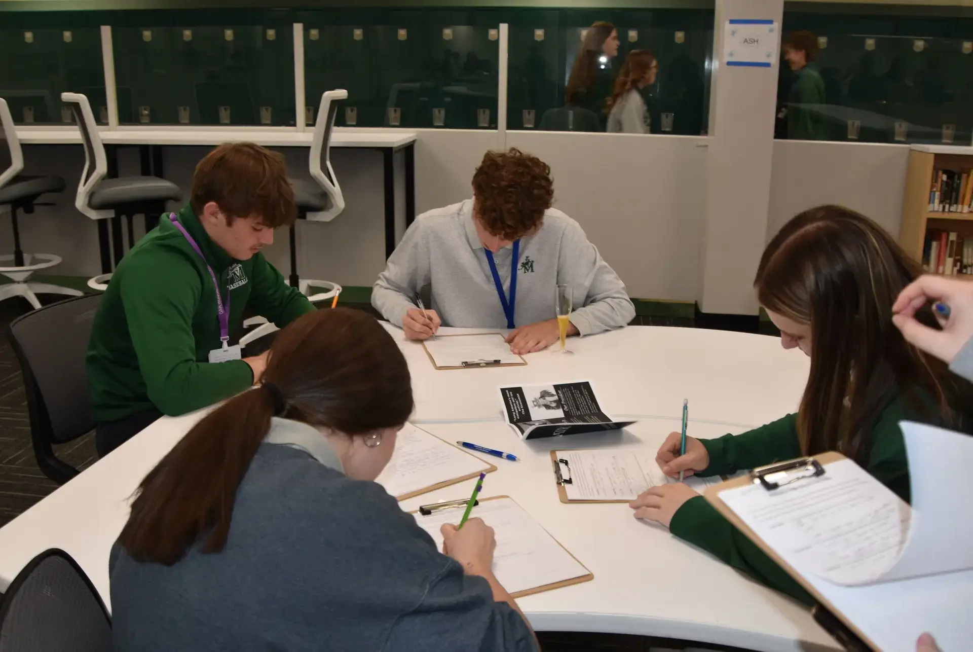 STVM students filling out forms for a mock election in class.