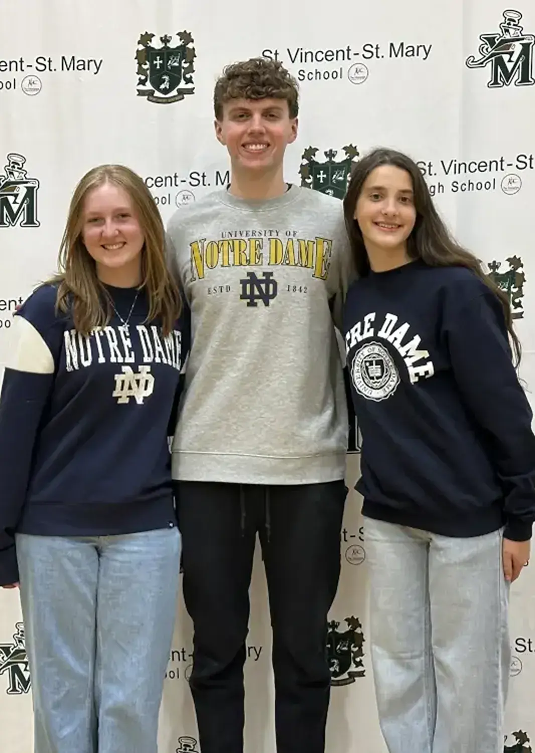 St Vincent St Mary High School students wearing college sweatshirts.
