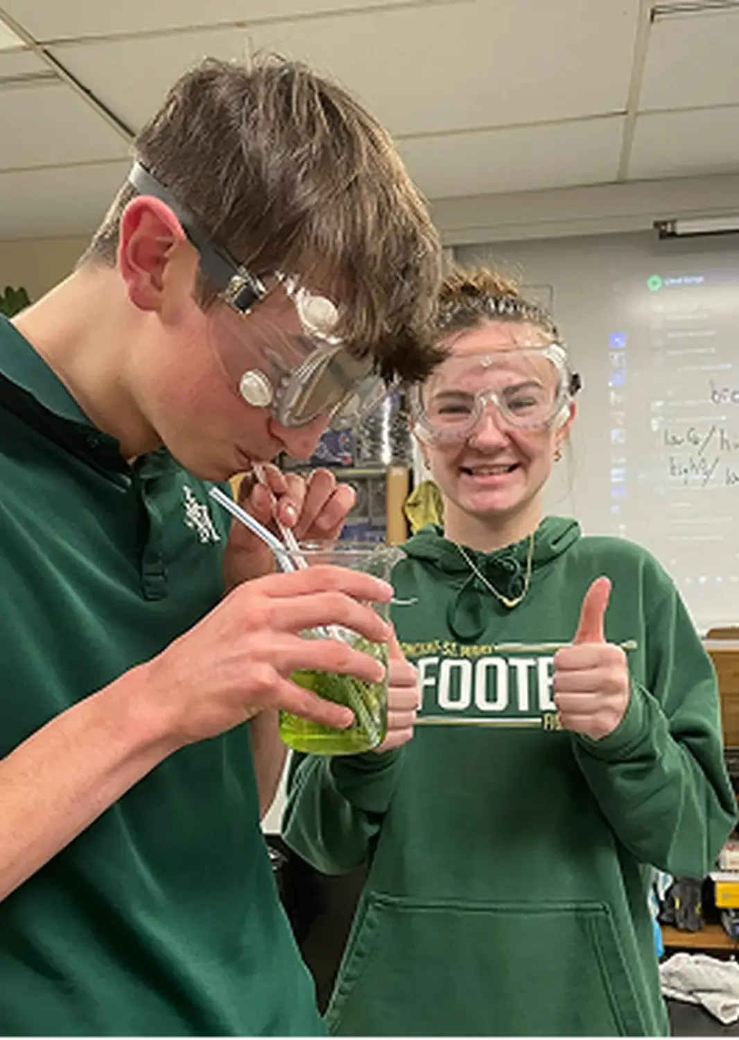 St Vincent St Mary High School students in a science class, giving thumbs up.