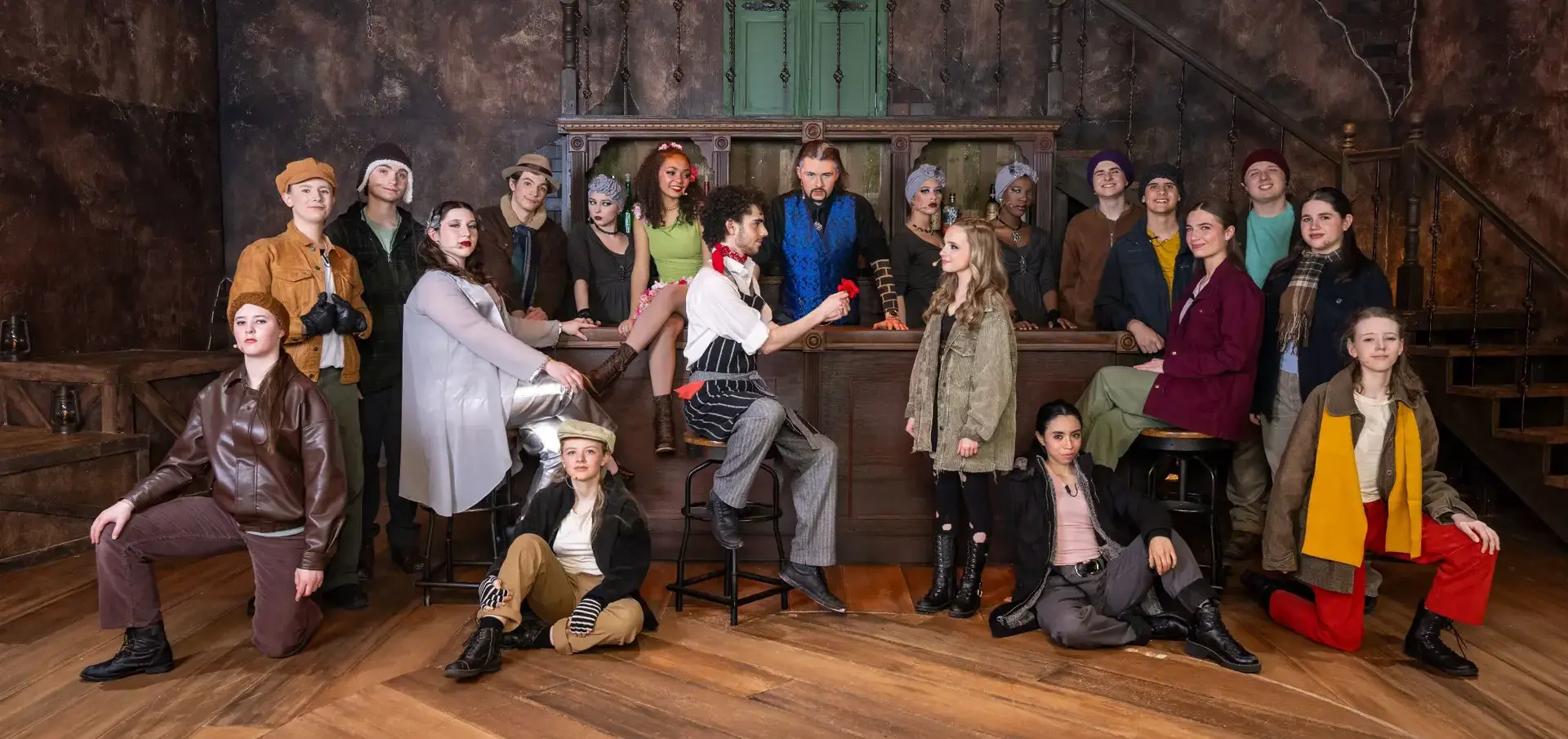 STVM student theater production cast posing for a photo on set.